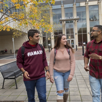Group of students walking outside the law school on the Camden campus. 